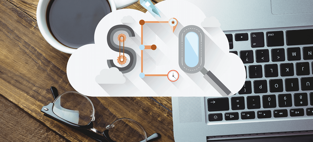 SEO cloud graphic on laptop workspace