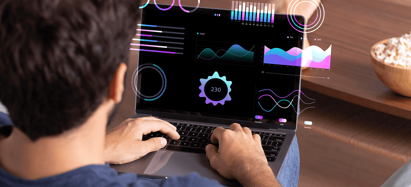 Person analyzing interactive data visualizations on laptop